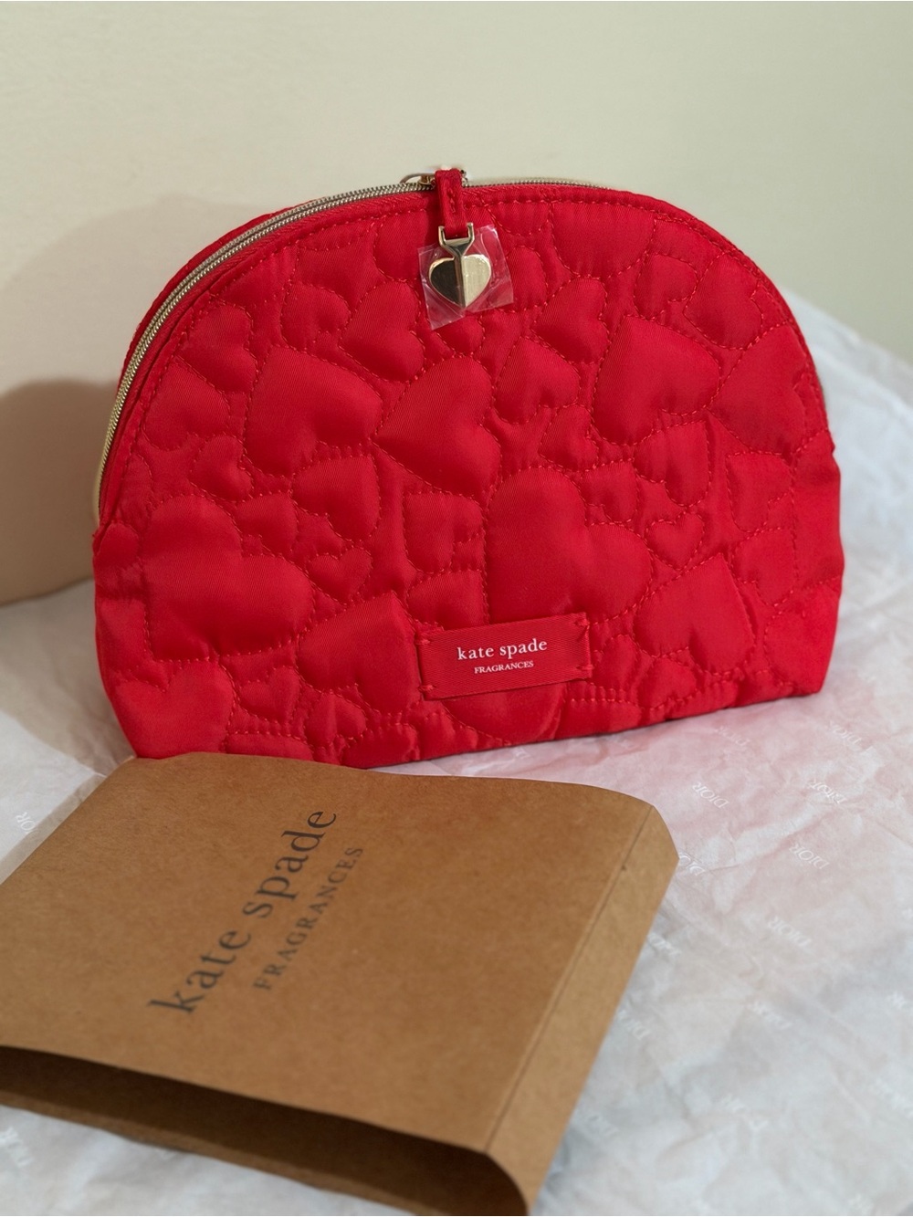 kate spade red quilted heart zip cosmetic pouch with gold-tone heart charm
